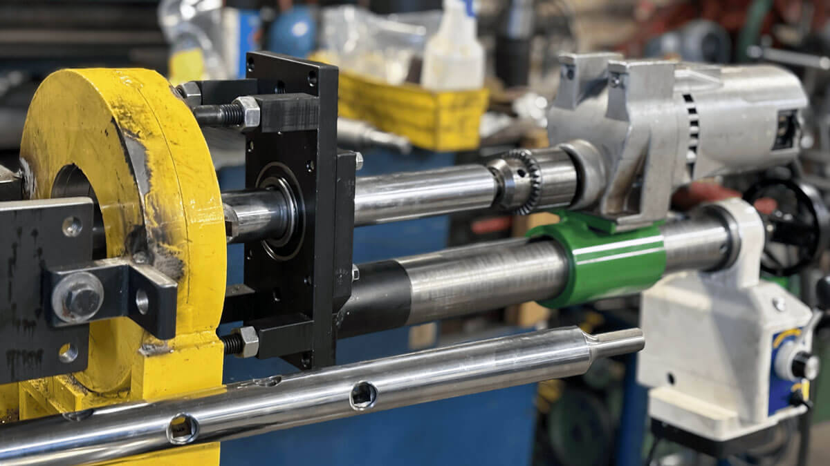 IRM line boring power feed advancing a boring bar through a bore