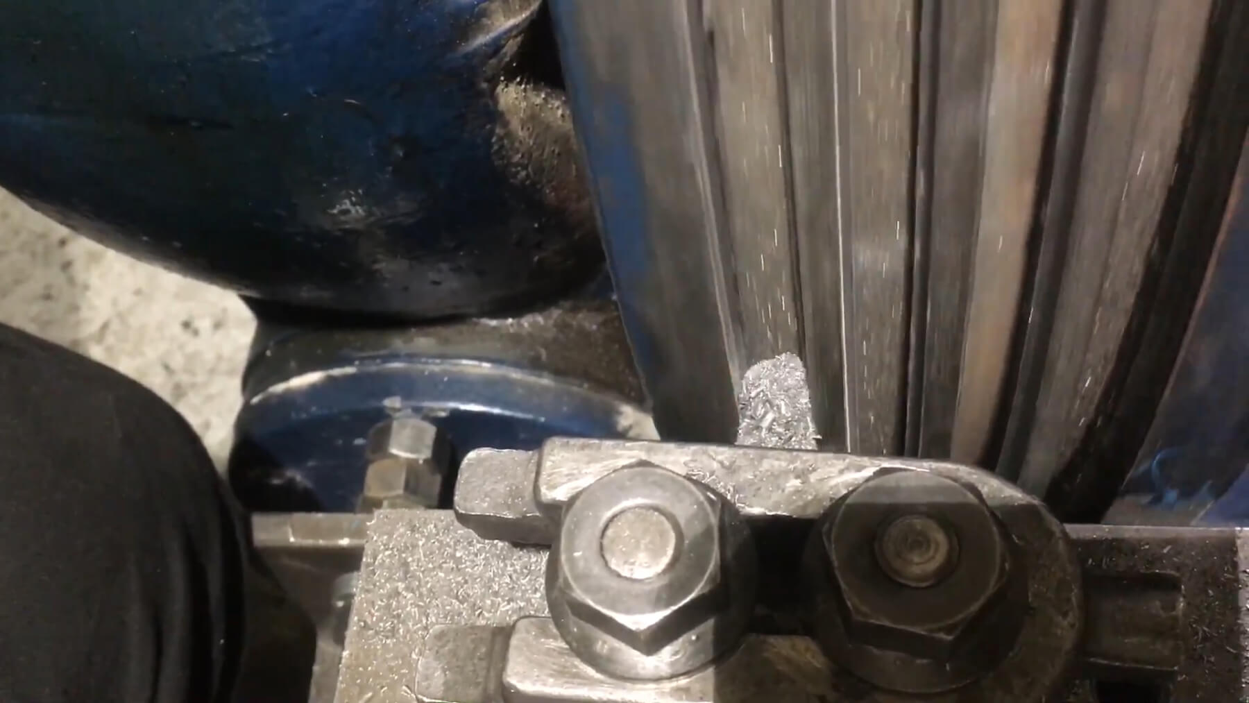 Close-up of an elevator drive sheave being regrooved on site